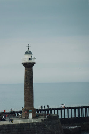Lighthouse on the promenade of the city of Whitby, UKの写真素材