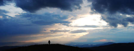 lonely man travelling over the tops of the Carpathian mountainsの写真素材