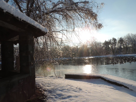 Sun reflection on lake on cold winter morningの写真素材