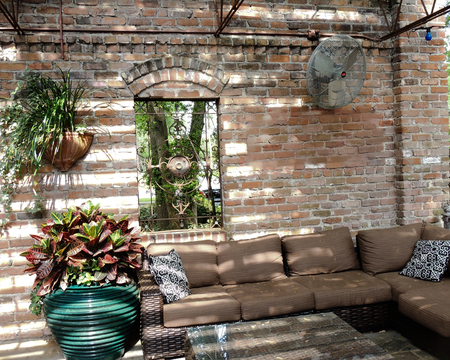 Comfortable and cozy bright outdoor lounge on a sunny dayの写真素材