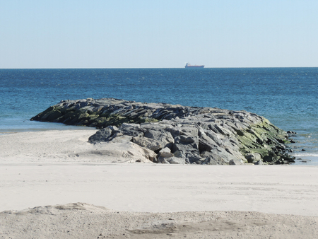 Jetty on the Atlantic Ocean on a clear spring dayの写真素材