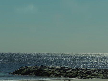 Jetty on the Atlantic Ocean on a clear spring dayの写真素材