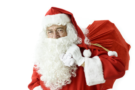 Smiling Santa Claus with presents bag on white backgroundの写真素材