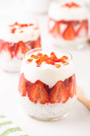 Breakfast of Greek Yogurt Glass with chia and strawberries.の写真素材