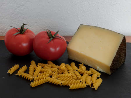 Pasta type penne with the first well defined and blurred backgroundの写真素材