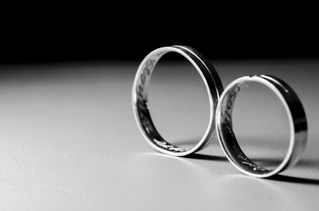 Pair of wedding rings on the tableの写真素材