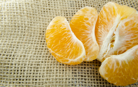 Open tangerine on fabricの写真素材