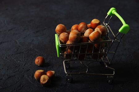 Hazelnuts, filbert on wooden backdrop. heap or stack of hazelnuts. Hazelnut background, healty foodの写真素材