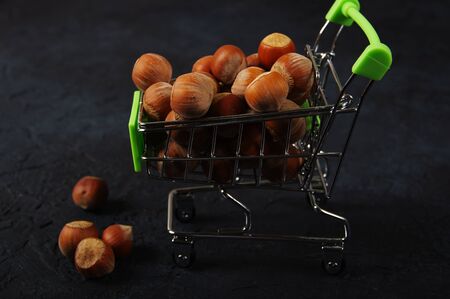 Hazelnuts, filbert on wooden backdrop. heap or stack of hazelnuts. Hazelnut background, healty foodの写真素材