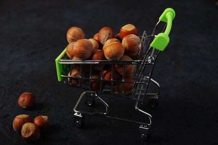 Hazelnuts, filbert on wooden backdrop. heap or stack of hazelnuts. Hazelnut background, healty foodの写真素材