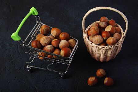 Hazelnuts, filbert on wooden backdrop. heap or stack of hazelnuts. Hazelnut background, healty foodの写真素材
