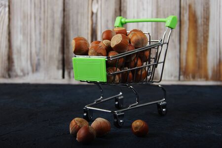 Hazelnuts, filbert on wooden backdrop. heap or stack of hazelnuts. Hazelnut background, healty foodの写真素材