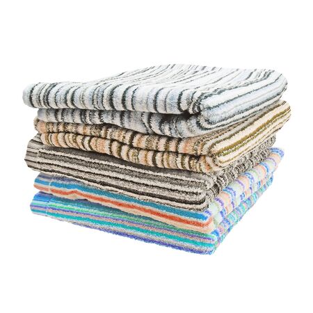 Stack of terry towels. Striped towels. Different colors. Five pieces. Isolated image on white background. Set.の写真素材