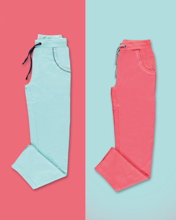 Bright sports pants on a colored background. Blue and coral.の写真素材