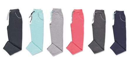 Collection of colored trousers on a white background. Isolated image on a white background. Nobody.の写真素材