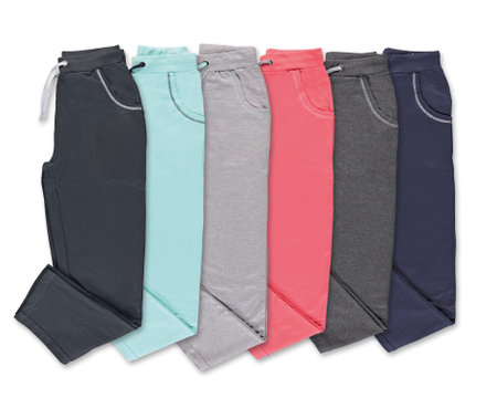 Collection of colored trousers on a white background. Isolated image on a white background. Nobody.の写真素材