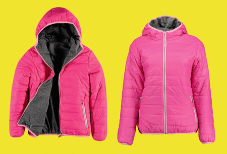 Pink warm quilted jacket with a hood. Two types. Fuchsia color. Bomber jacket on a yellow background. Isolated image. Photo on a mannequin.の写真素材