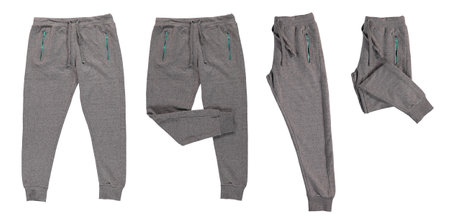 Pants folded in half. Warm gray pants with red, blue zippers. Isolated image on a white background. Nobody.の写真素材