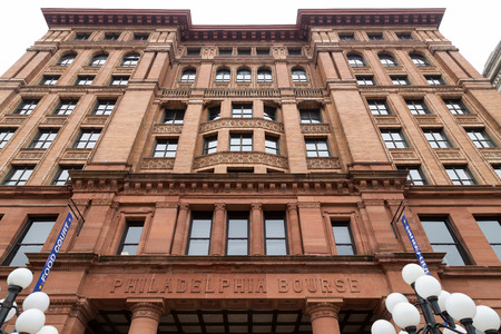 Philadelphia, PA, USA - November 19, 2014. Facade of the Philadelphia Bourse Building viewed from below. Currently, a tourist place, the building houses shops and restaurantsのeditorial素材