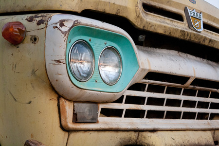 Matao, SP, Brazil - June 25, 2011. Front of a rusty and old yellow ford.のeditorial素材