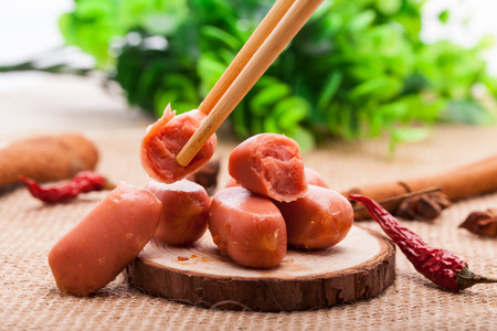 Sausage on a wooden boardの写真素材