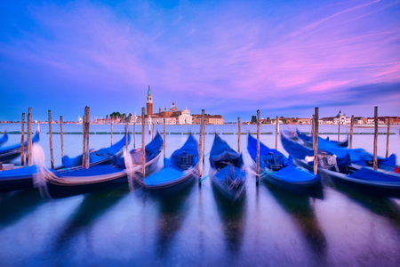 Photo of the sunset time in venice with the gondolasの写真素材