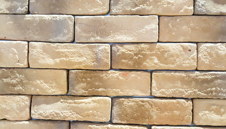 Background material, Decorative material the wall is patterned like a light brown brick.