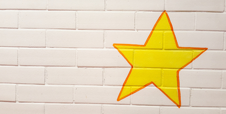 Brightly decorated brick walls with large yellow stars.の写真素材