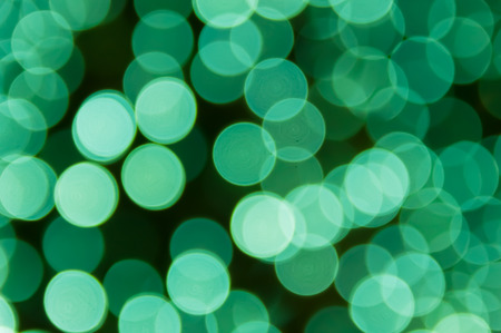 A full-frame bokeh image of a green circle scattered nicely.の写真素材