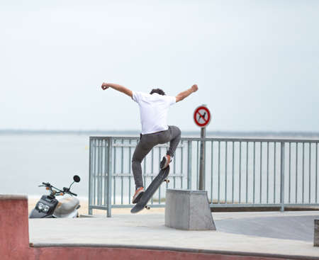 Skateboarder skateboarding on skatepark rampの写真素材