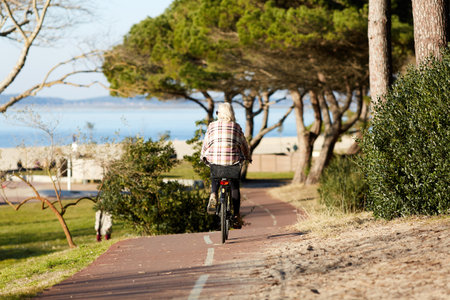 Person riding a bicycle on a cycle pathの写真素材