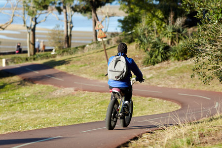 Person riding a bicycle on a cycle path
