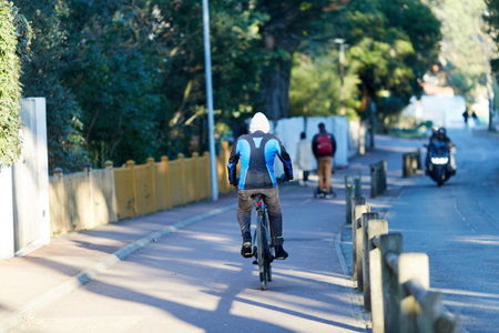 Person riding a bicycle on a cycle path