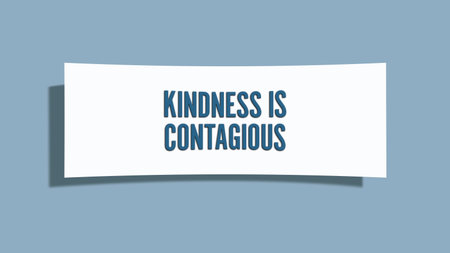 Kindness is contagious. A card isolated on blue background.