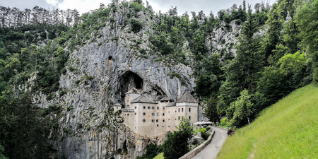Predjama, Predjama/Slovenia; 06/06/2018: a frontal view of the Predjama Castle in the Predjama Caves, Sloveniaのeditorial素材