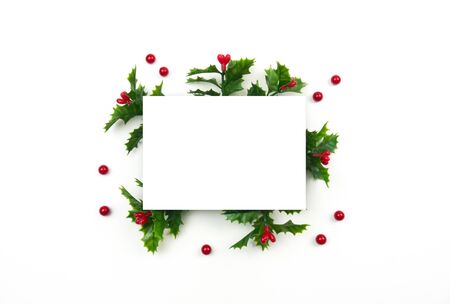 Creative Christmas layout. Mistletoe on white background whit copy space. Flat lay top view.の写真素材