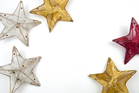 Creative Christmas layout. Decorative stars on white background whit copy space. Border arrangement. Flat lay top view.の写真素材