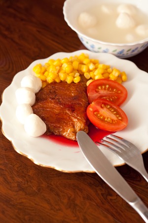 Dish with fried meat and sauceの写真素材