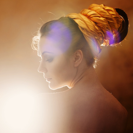 girl on a gold backgroundの写真素材