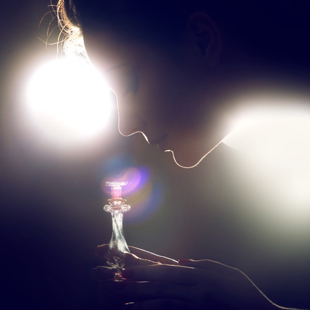 Elegant woman with perfumeの写真素材