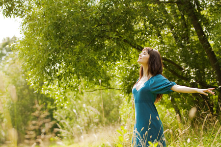 young beautiful girl on a meadowの写真素材