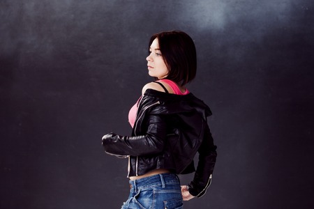 young woman hip hop dancer,  on a dark backgroundの写真素材