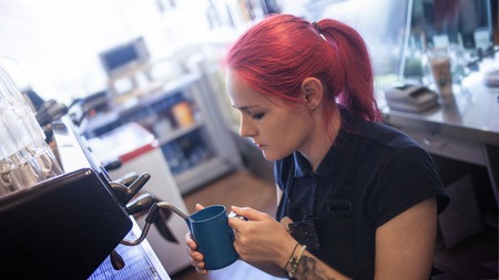 Espresso machine making coffee in pub, barの写真素材