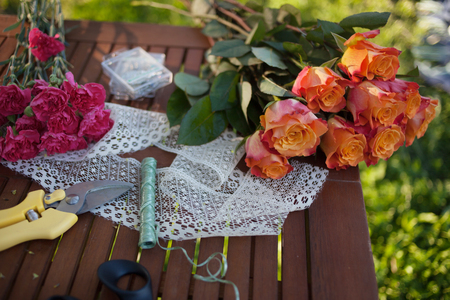 flowers and tools on the table, florist workplaceの写真素材