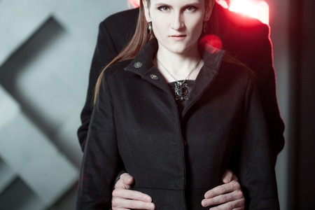 portrait in the harsh light and with the effect of red toningの写真素材