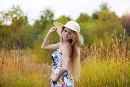 The young beautiful girl on a meadowの写真素材
