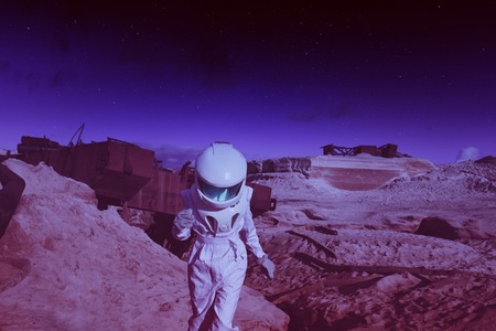 futuristic astronaut on another planet, sandy red planet