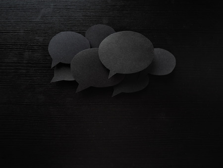 three clouds for text made from Real materials, paper and wooden backgroundの写真素材