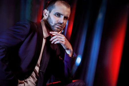 serious man in a business suit, darkの写真素材