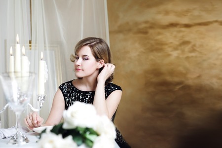 young woman sitting at the Banquet table